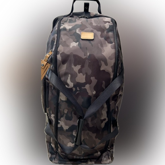 Tumi Handbags - NWT Tumi PINEHURST collapsable Wheeled Duffel bag